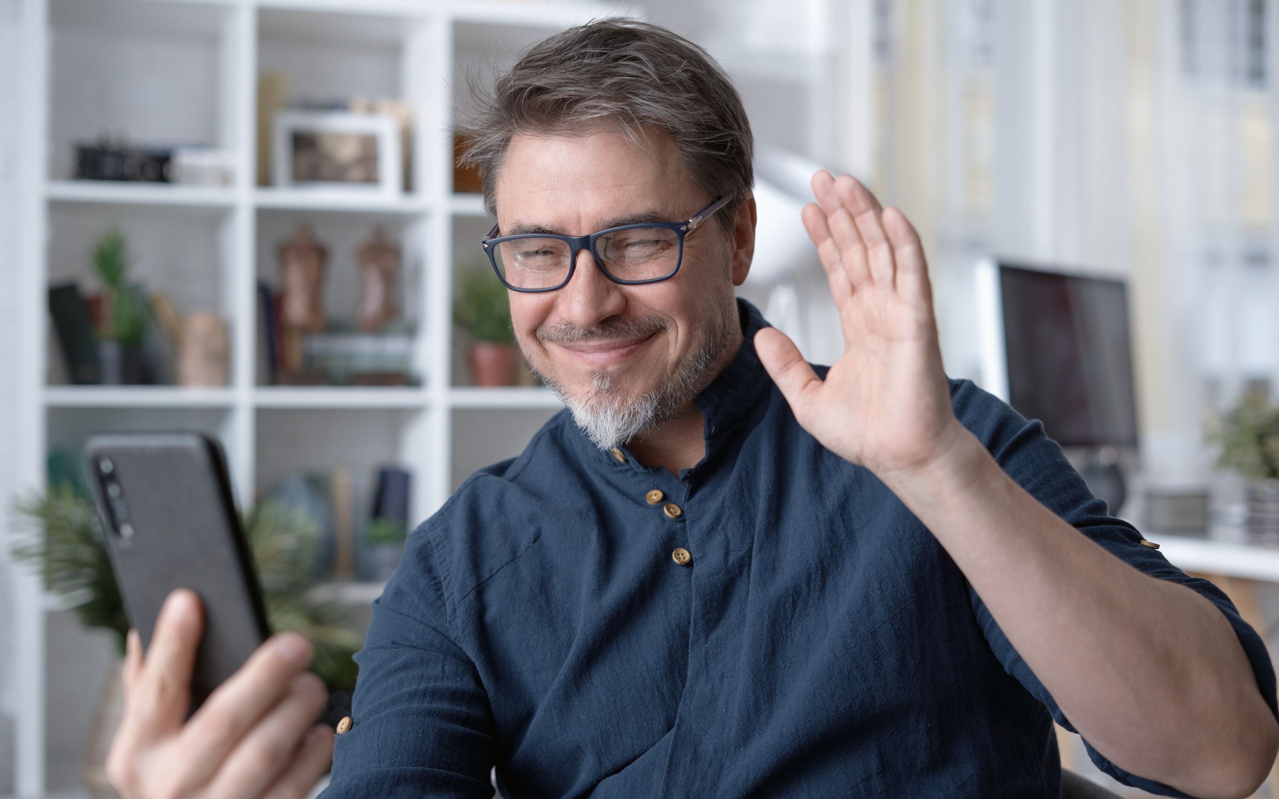 Man client on virtual call with Scott E. Burgess during a free 15-min discovery Zoom call, exploring health goals and next-step options.