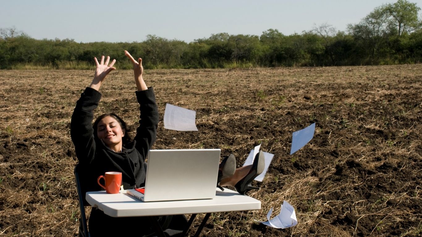 Woman celebrating freedom after Virtual RTT with Scott E. Burgess, releasing past roadblocks and embracing clarity, healing, and empowerment.