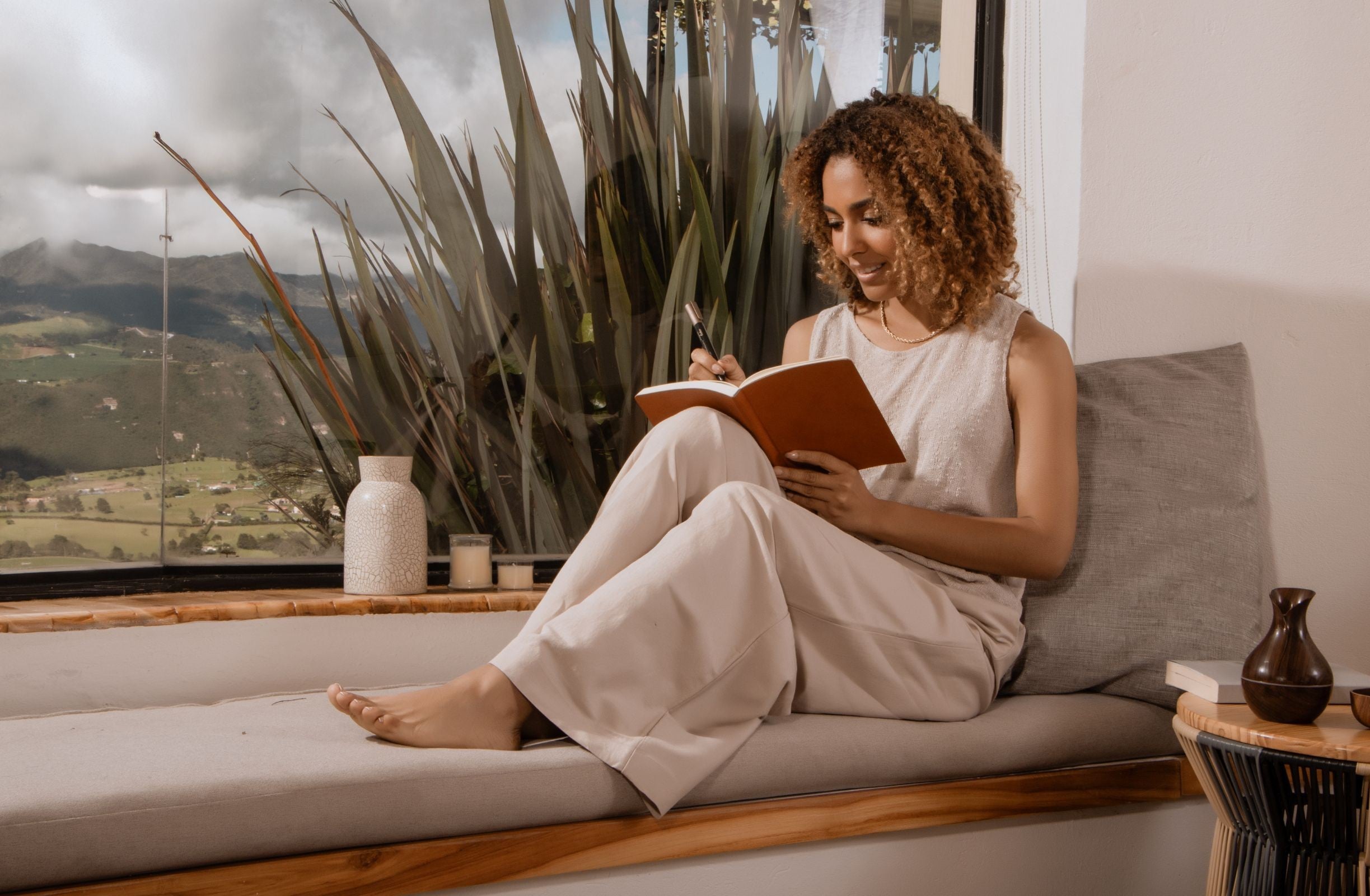 Woman journaling after in-person RTT session with Scott E. Burgess, reflecting on insights and breakthroughs for lasting transformation.